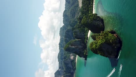 vertical aerial view on exotic tropical island and seacliffs over white sand beaches, krabi thailand