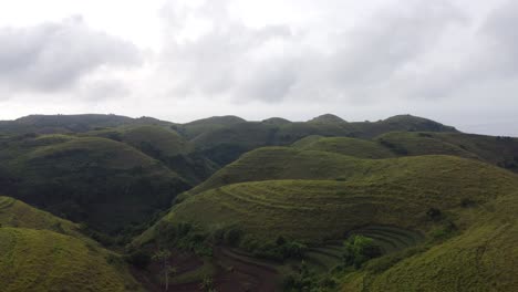 aerial, verdant teletubbies hills in nusa penida tropical island, bali indonesia