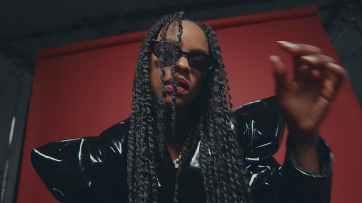 Cinematic shot of an African model girl having long braids