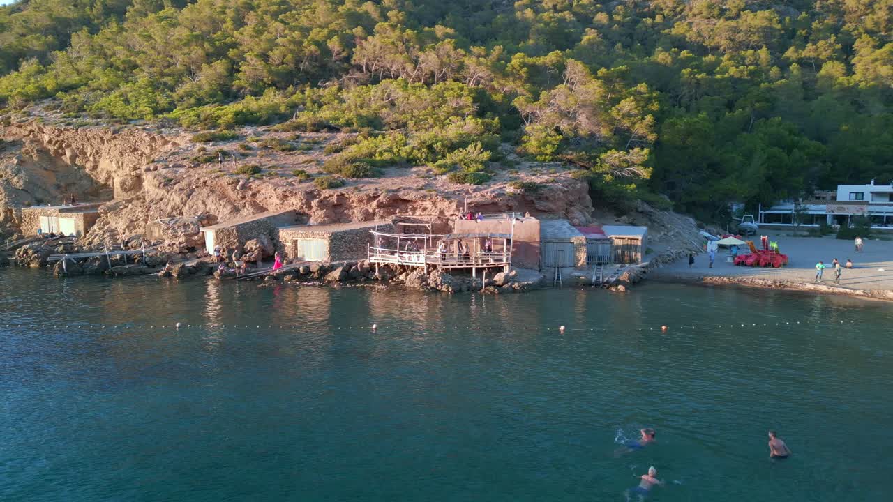 Swimmers enjoy the last rays of the sun