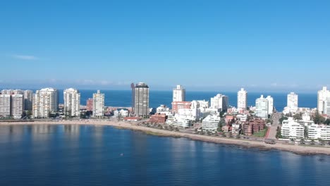 aerial view of coastal city with beach and ocean