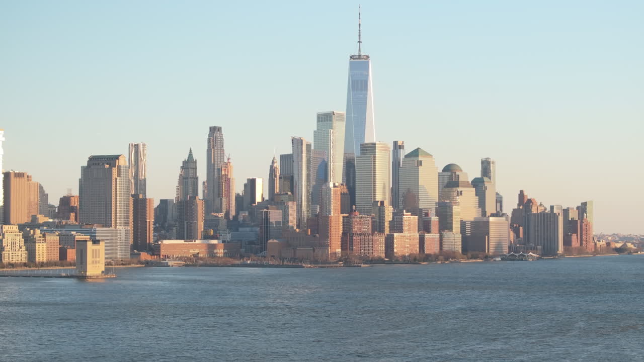 Aerial view of The World Trade Center at dusk. Shot along The Hudson River in New Jersey.