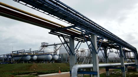 camera shows spherical reservoirs at refinery plant