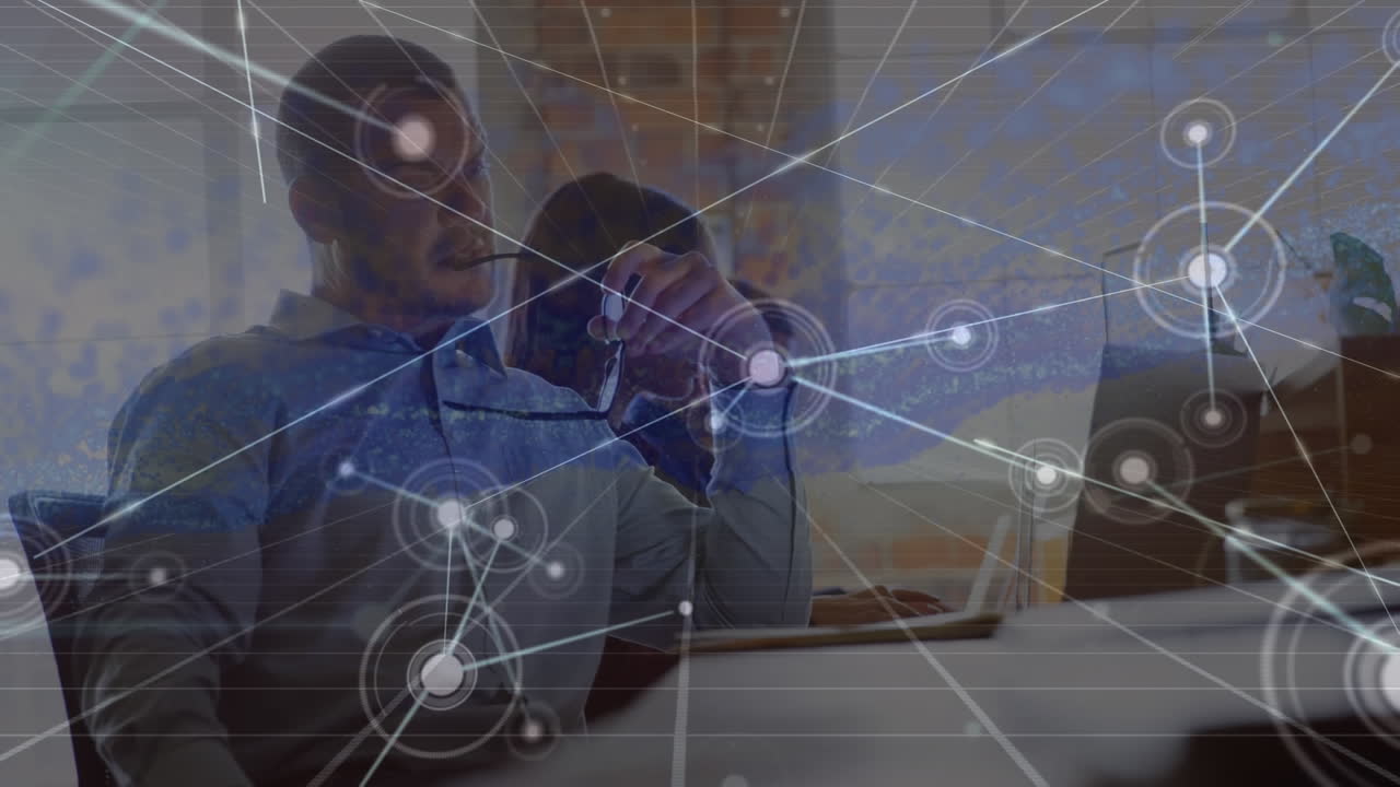 Animation of network of connections over diverse business people working in office