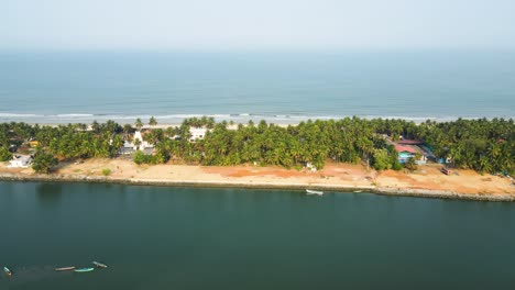 aerial drone shot of an island paradise with coconut trees in udupi