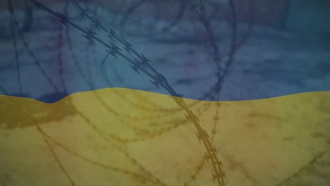 animation of flag of ukraine over field and barbed wire