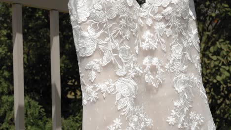 Close-up-of-the-designs-in-the-fabric-of-a-beautiful-designer-dress-outside-on-a-beautiful-sunny-day