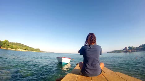 4k beach yoga, caucasian girl on a dock, wide shoot, quad hd