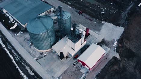 Overhead-orbit-of-a-farm's-grain-processing-facility