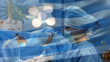 Animation-of-flag-of-uruguay-waving-over-surgeons-in-operating-theatre