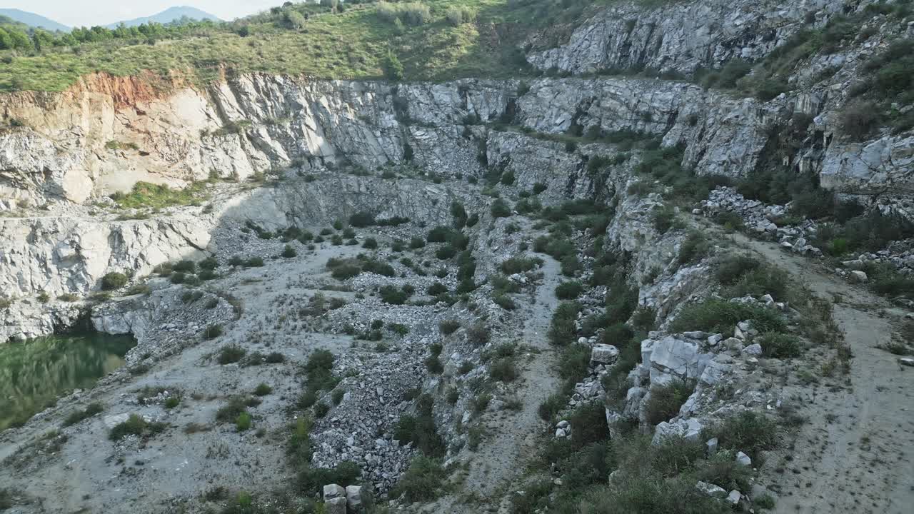 Panoramic view of a large quarry with green water at the bottom, showing different perspectives of the quarry's landscape and surrounding vegetation