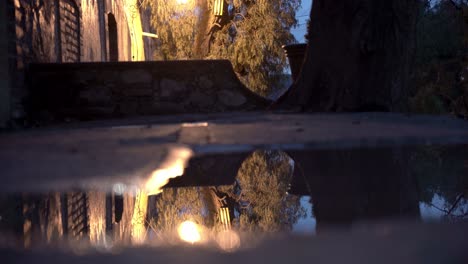 Puddle-on-a-sidewalk-at-night