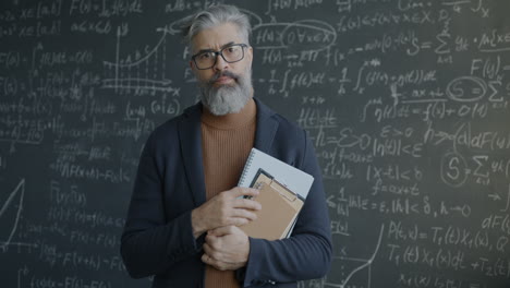 Teacher in front of a chalkboard full of equations