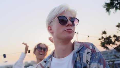 Caucasian-friends-dancing-at-the-party-in-top-of-the-roof.