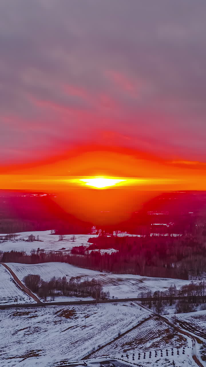 Intense sunset colors firing up in the winter sky captured in stunning hyperlapse