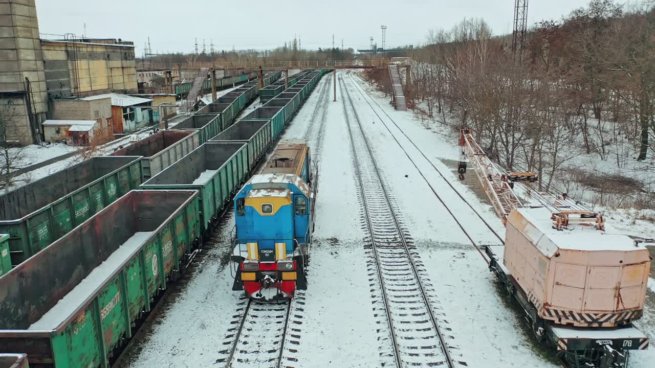 Cargo railway transportation industry. Aerial view of colorful freight trains on the railway station