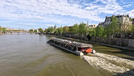 a boat cruises along the seine river