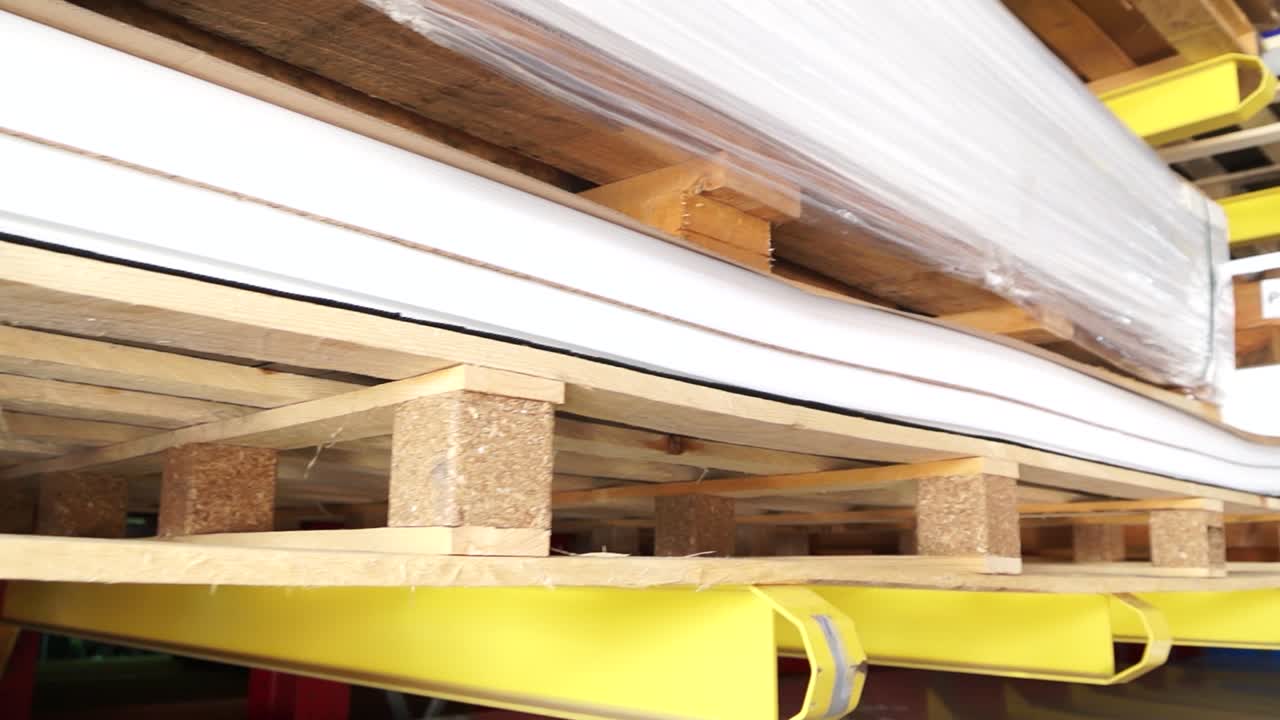Pallets of White Sheets in a Warehouse