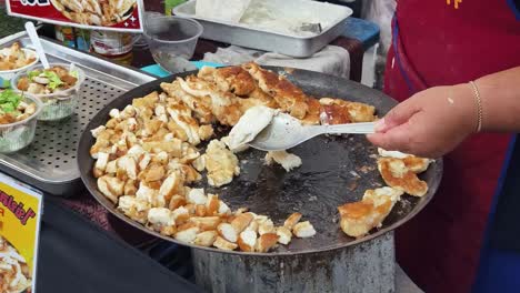 street food vendor cooking fried chicken