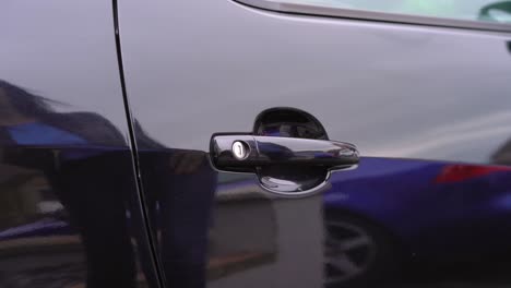 car door unlocking with bunch of keys in womans hand