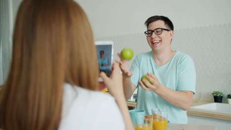 couple taking a photo of breakfast fun