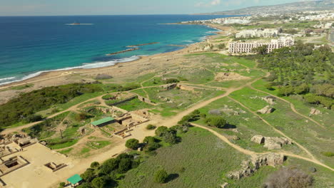 Aerial-view-of-Tombs-of-the-Kings,-ancient-ruins-in-Paphos,-Cyprus,-near-the-coastline