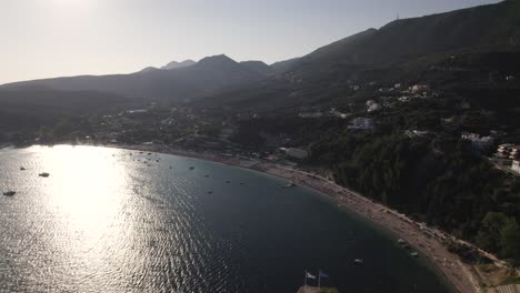 Aerial-Cinematic-Flying-Back-Over-Hillside-With-Parga-Castle