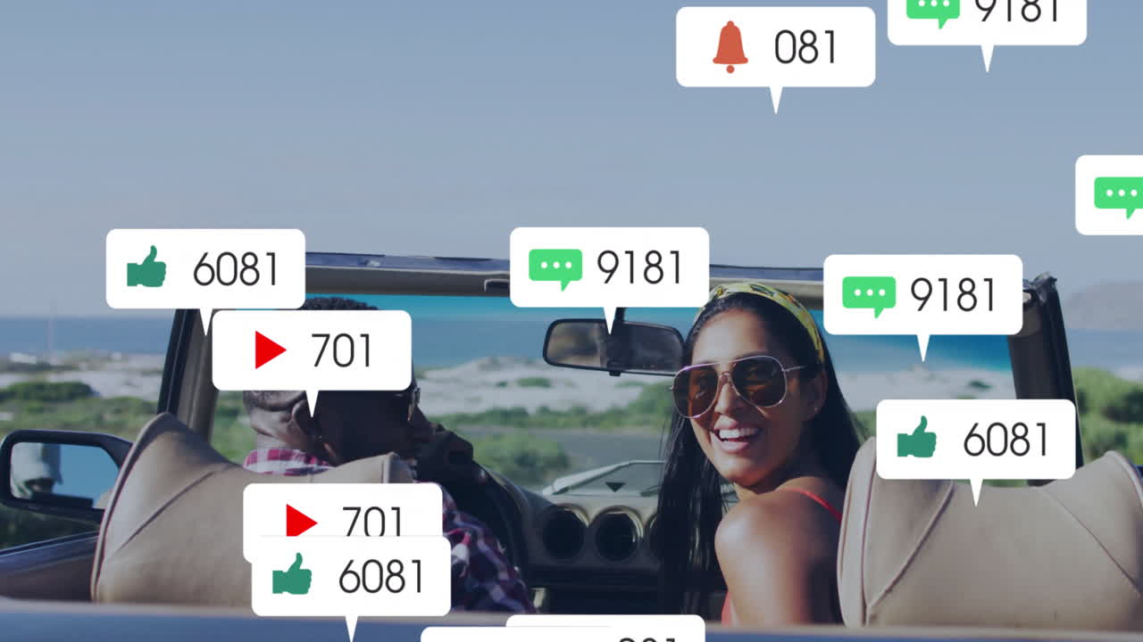 In convertible by beach, people receiving animation of social media notifications