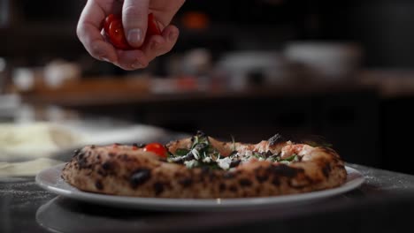 chef preparing a pizza with fresh ingredients