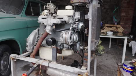 freestanding engine from an old volga m21 in the workshop yard