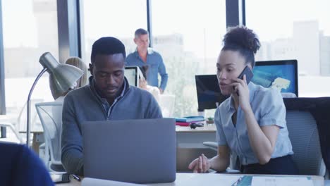 Young-man-and-woman-working-on-computer