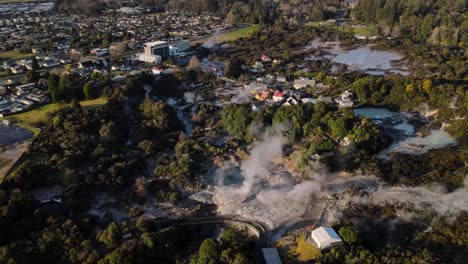 Aerial-of-Pohutu-Geyser-reveal-scenery-of-Rotorua-Cityscape-on-Lake