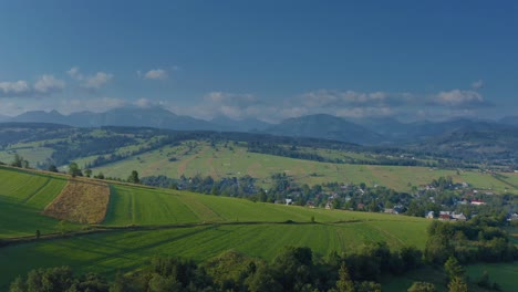 Panorama-Of-Rural-Village,-Fields,-And-Mountains-In-Dzianisz,-South-Western-Podhale,-Poland