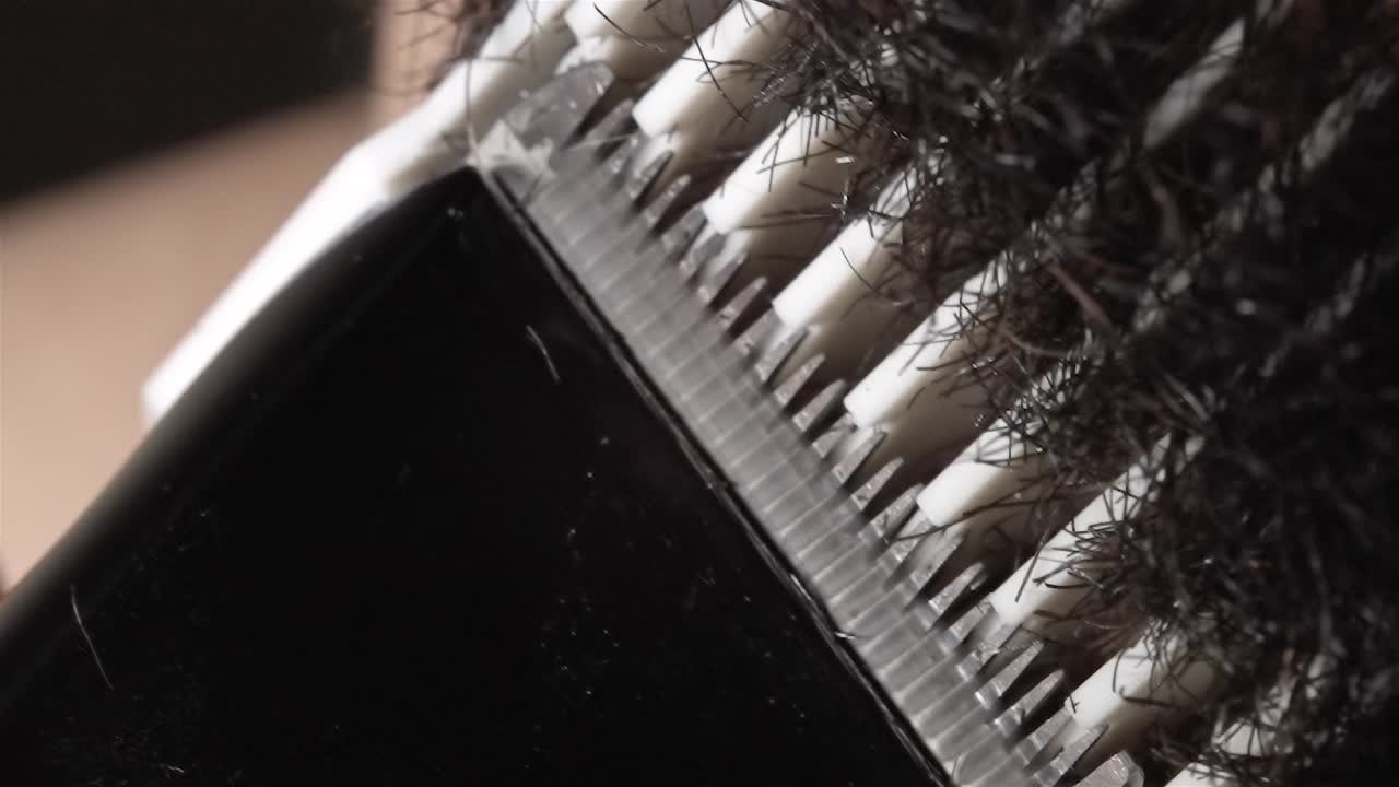 Macro Beard Trim: Close-Up Electric Shave in Action