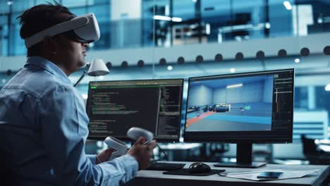 industrial software developer writing code and testing automotive manufacturing interface. engineer editing electric motor and car chassis while wearing virtual reality headset and using controllers.