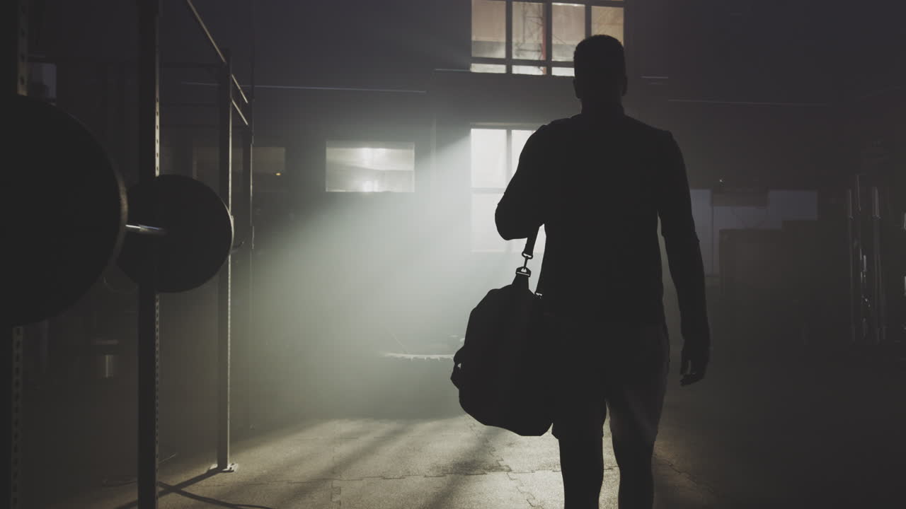 Man leaving the gym with sports bag