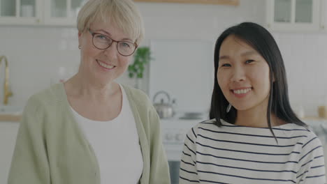 portrait of two women in a kitchen