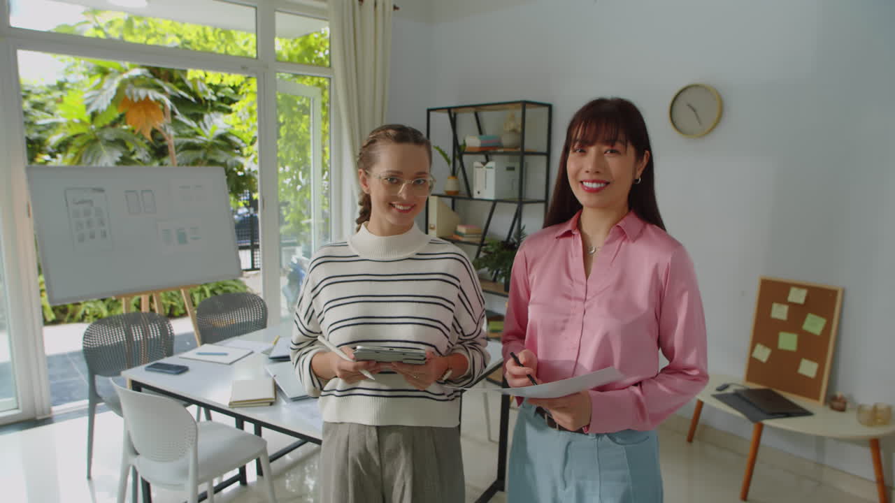 Multicultural Female Startup Workers Smiling at Camera