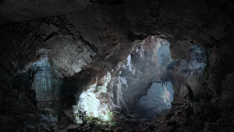 dark cave entrance with sunlight shining through