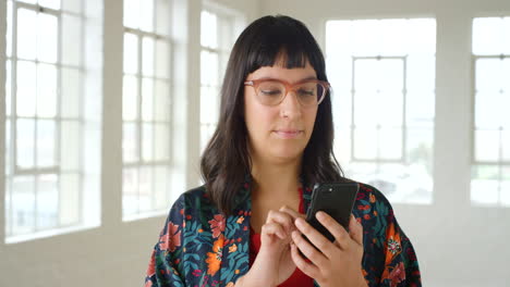 Young-stylish-woman-using-a-phone