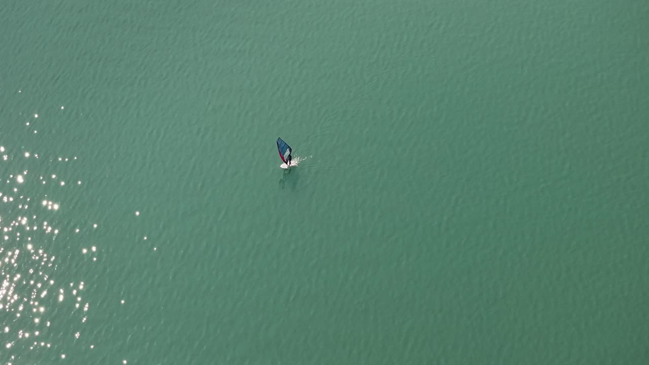Windsurfing on a calm lake