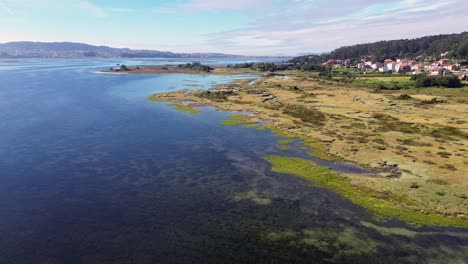 drone aerial view of toja island and bridge in pontevedra, spain