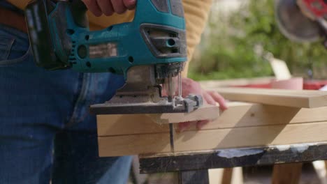 close up when cutting the corner of the piece of wood