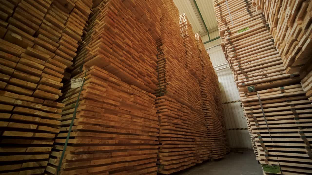 Large Stacks of Lumber in an Industrial Wood Processing Warehouse