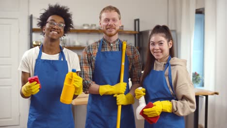 multiethnic team of professional janitors in uniform indoors.