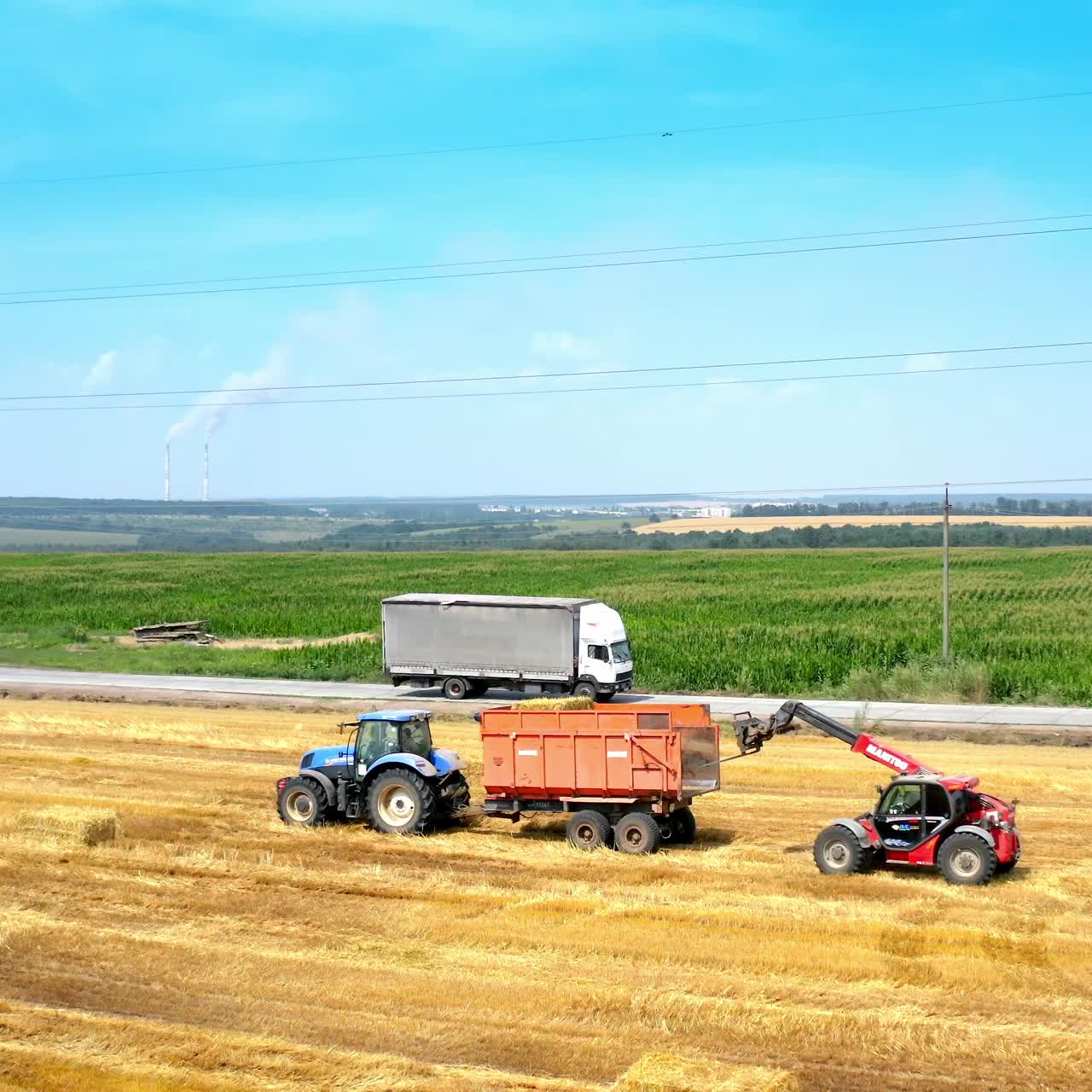 Bales of hay stacked in trailer. Agricultural field after harvest prepared for farming stack