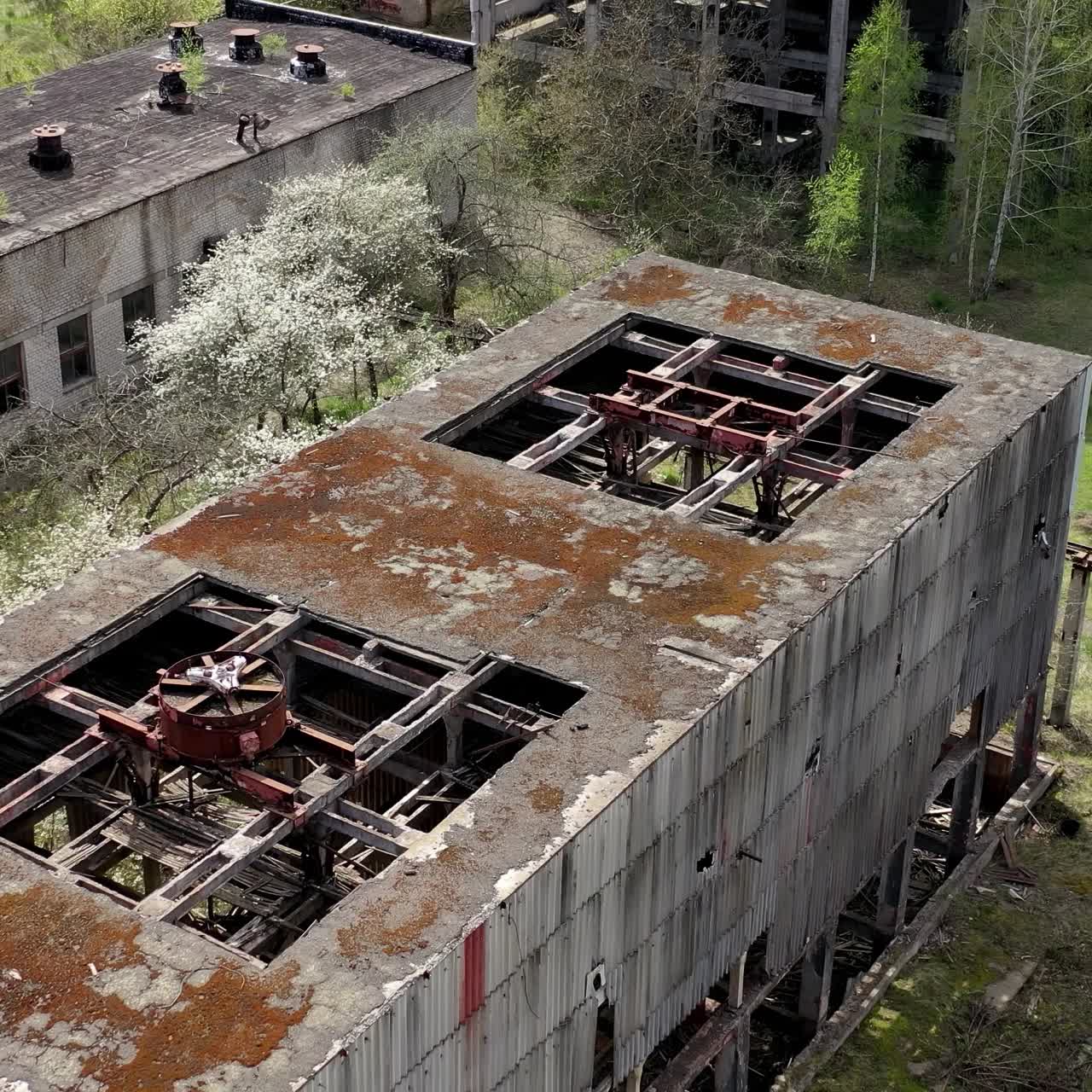 Aerial shot of abandoned old city. Empty damaged buildings exterior