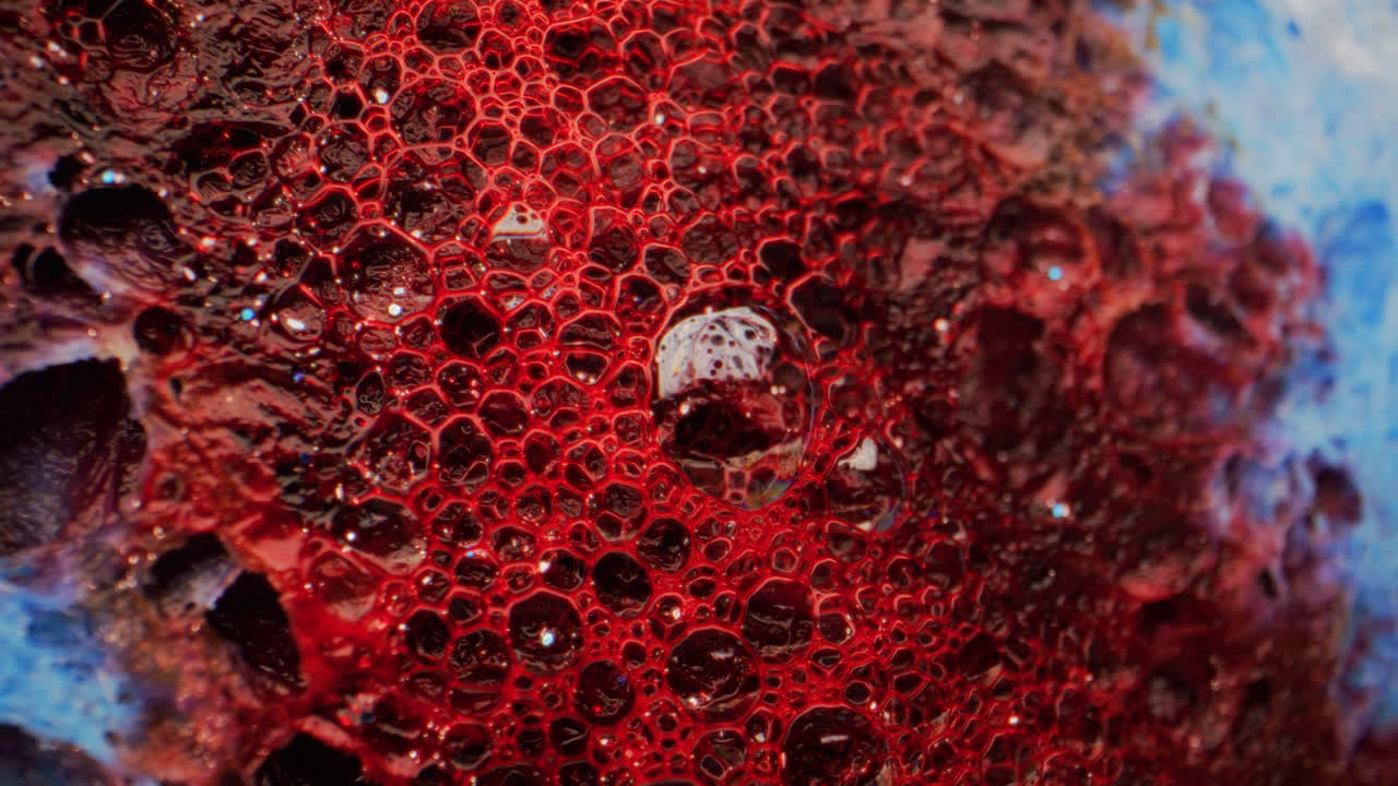 Abstract Macro Photography of Red Paint and Bubbles