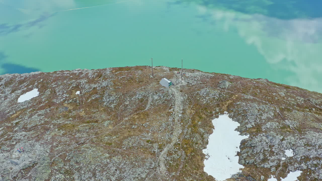Majestic aerial view of Sogndal, Norway with the Sognefjord, lush mountains, and Sogndal Bridge under clear skies. Breathtaking Nordic landscape in soft natural light