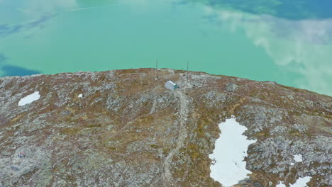 majestic aerial view of sogndal, norway with the sognefjord, lush mountains, and sogndal bridge under clear skies. breathtaking nordic landscape in soft natural light